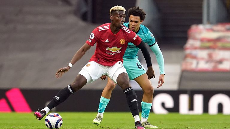Manchester United's Paul Pogba (left) and Liverpool's Trent Alexander-Arnold battle for the ball during the Premier League match at Old Trafford