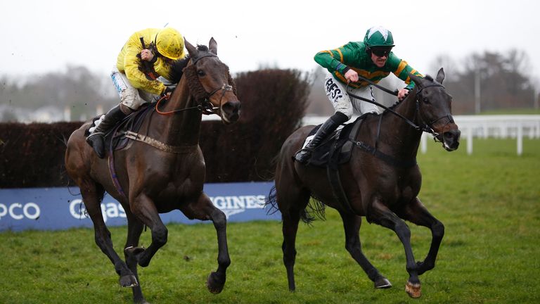 Regal Encore and Richie McLernon (right) lead Acting Lass and Sean Bowen over the last fence at Ascot