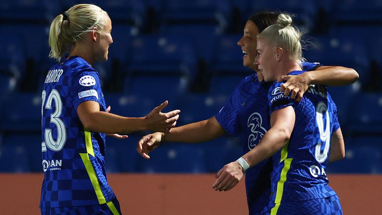 Sam Kerr of Chelsea celebrates with Pernille Harder and Bethany England after scoring their side's first goal vs Wolfsburg