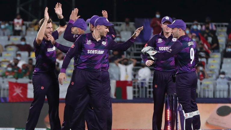 Scotland's players celebrate the dismissal of Oman's batsman Jatinder Singh during the Cricket Twenty20 World Cup first round match between Oman and Scotland in Muscat, Oman