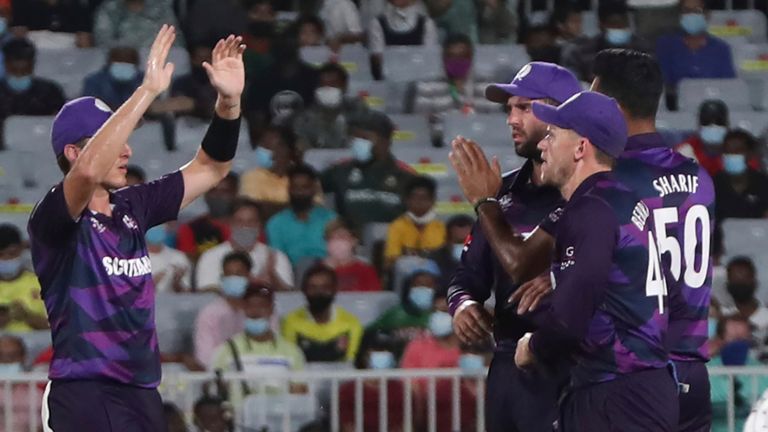 Scotland's players celebrate the dismissal of Oman's batsman Kashyap Prajapati during the Cricket Twenty20 World Cup first round match between Oman and Scotland in Muscat