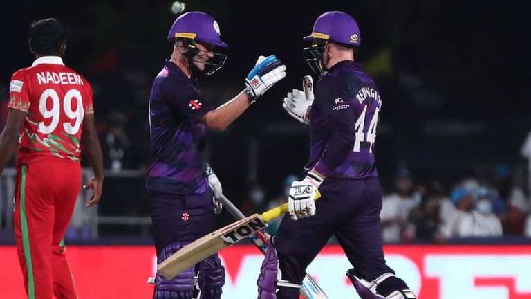 Scotland's batsman Matthew Cross, left, celebrates with teammate Richie Berrington for scoring the winning runs at the end of the Cricket Twenty20 World Cup first round match between Oman and Scotland in Muscat