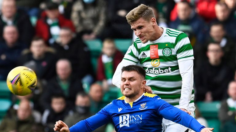 GLASGOW, SCOTLAND - OCTOBER 23: St Johnstone's Glenn Middleton competes with Carl Starfelt during the cinch Premiership match between Celtic and St Johnstone at Celtic Park on October 23, 2021, in Glasgow, Scotland. (Photo by Rob Casey / SNS Group)