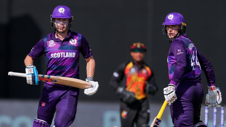 Scotland's batsmen Matthew Cross, left, and Richie Berrington watch the ball during the Cricket Twenty20 World Cup first round match between Scotland and Papua New Guinea in Muscat, Oman, Tuesday, Oct. 19, 2021. (AP Photo/Kamran Jebreili)