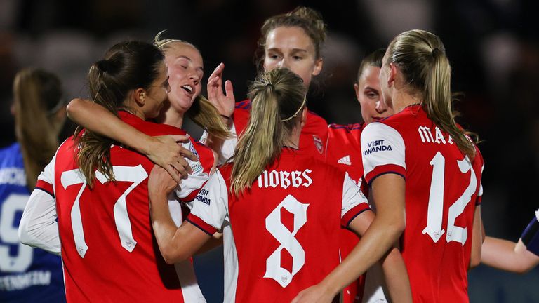 Tobin Heath is congratulated by her team-mates after giving Arsenal a two-goal lead