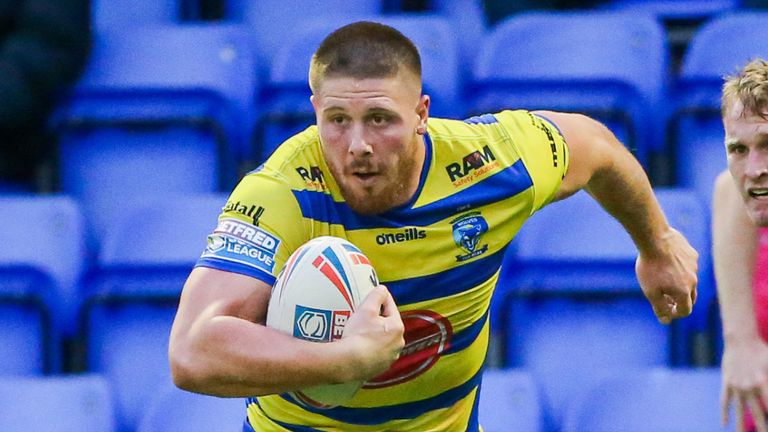 Picture by Alex Whitehead/SWpix.com - 05/07/2021 - Rugby League - Betfred Super League - Warrington Wolves v Leeds Rhinos - Halliwell Jones Stadium, Warrington, England - Warrington's Tom Lineham is tackled by Leeds' Liam Sutcliffe.