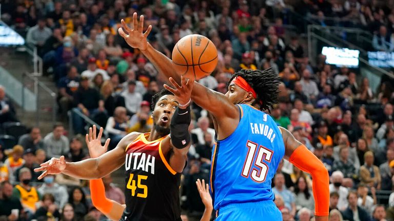 Utah Jazz guard Donovan Mitchell (45) goes to the basket as Oklahoma City Thunder center Derrick Favors (15) defends during the second half of an NBA basketball game Wednesday, Oct. 20, 2021, in Salt Lake City. (AP Photo/Rick Bowmer)