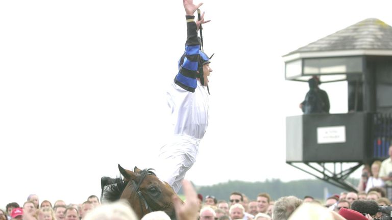 Frankie Dettori performs his famous flying dismount after victory in the 2003 Irish Oaks on board Paddy Mullins' Vintage Tipple