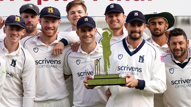 Warwickshire captain Will Rhodes holds the Bob Willis Trophy at Lord's