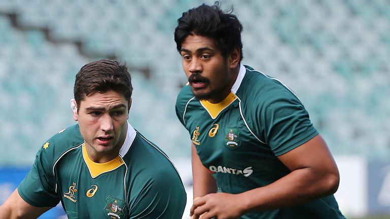 Australia rugby player Rob Simmons, left,  runs with the ball as Will Skelton follows in support  during a captains run in Sydney, Australia, Friday, June 24, 2016. England will try to making a clean sweep 3-0 when they play Australia in the 3rd test on Saturday, June 25, 2016.(AP Photo/Rob Griffith)