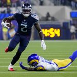 INGLEWOOD, CA - NOVEMBER 7: Tennessee Titans running back Adrian Peterson  #8 father Nelson Peterson holds up his son game worn jersey after the  Tennessee Titans game versus the Los Angeles Rams