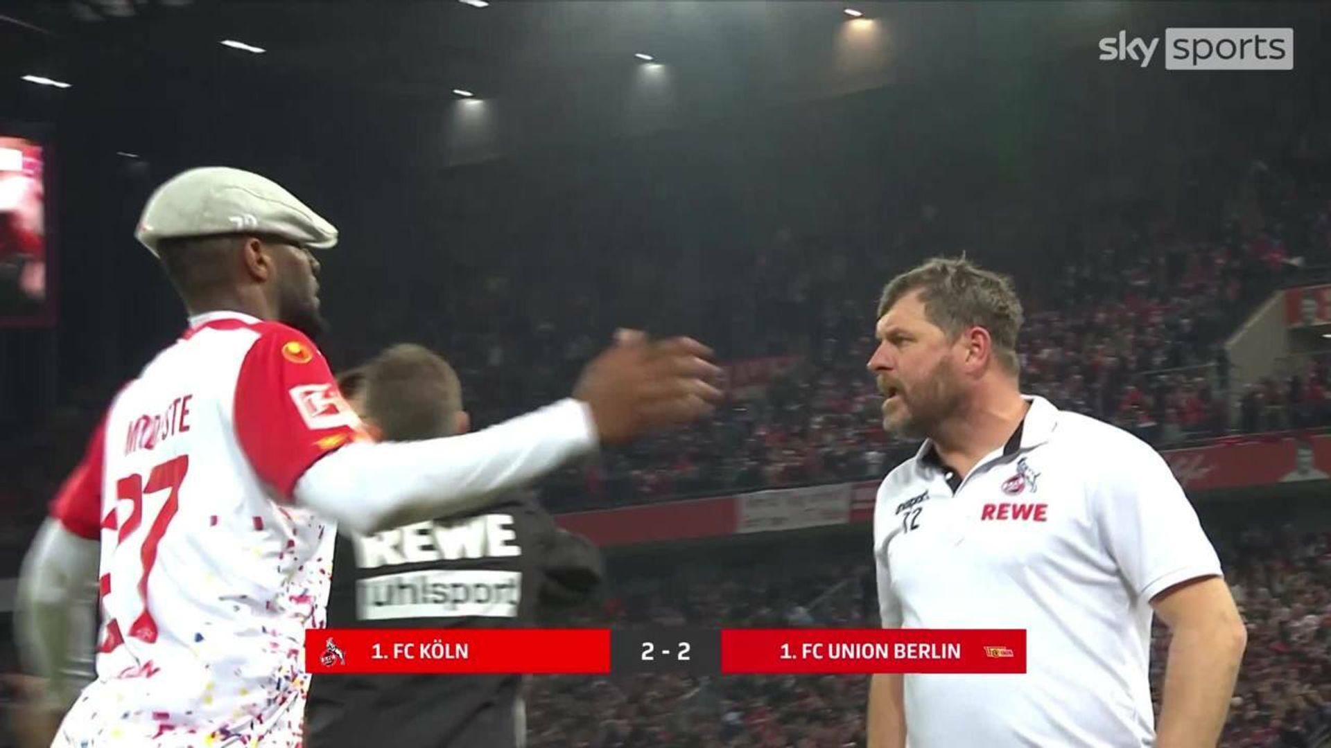 Modeste steals manager's hat to celebrate!