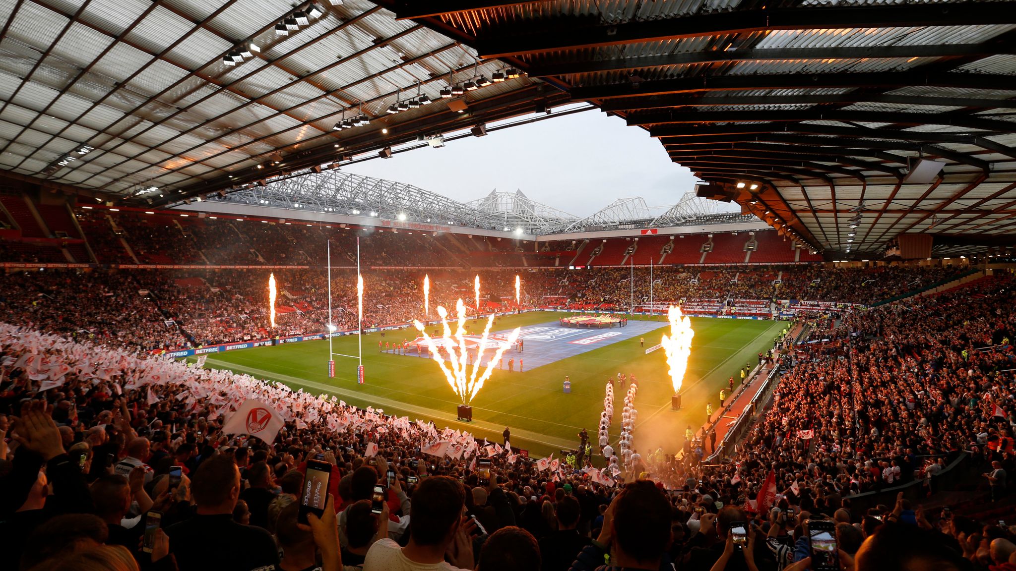 Players coming out for the start of the Super League Grand Final at Old Trafford.