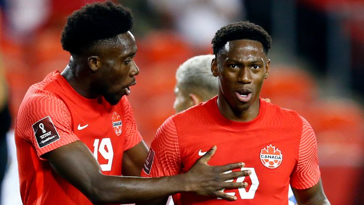 Alphonso Davies #19 of Canada speaks to Jonathan David #20 during a 2022 World Cup Qualifying match against Panama at BMO Field on October 13, 2021 in Toronto, Ontario, Canada.