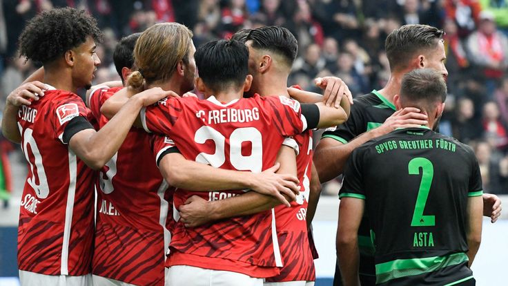 Freiburg's players celebrate their 1-0 (Furth's own goal) during the German first division Bundesliga football match SC Freiburg v SpVgg Greuther Furth in Freiburg, southern Germany, on October 30, 2021