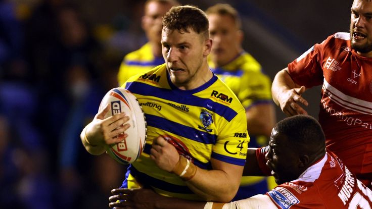 Warrington Wolves George Williams attempts to break away from Hull Kingston Rovers Muizz Mustapha during the Betfred Super League play-offs eliminator match at The Halliwell Jones Stadium, Wigan. Picture date: Friday September 24, 2021.