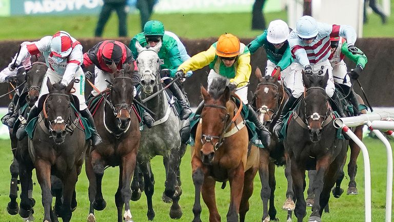 Midnight Shadow (orange cap) comes home in the Paddy Power Gold Cup, ahead of Lalor (far right) and Simply The Betts (far left)