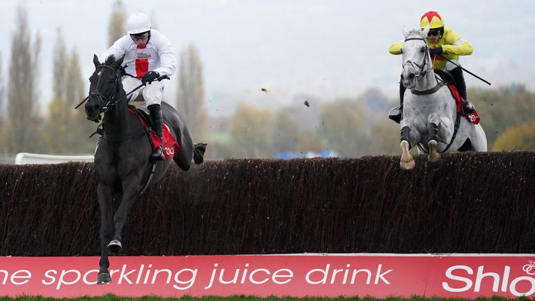 Harry Skelton riding Nube Negra (left) on their way to winning the Shloer Chase