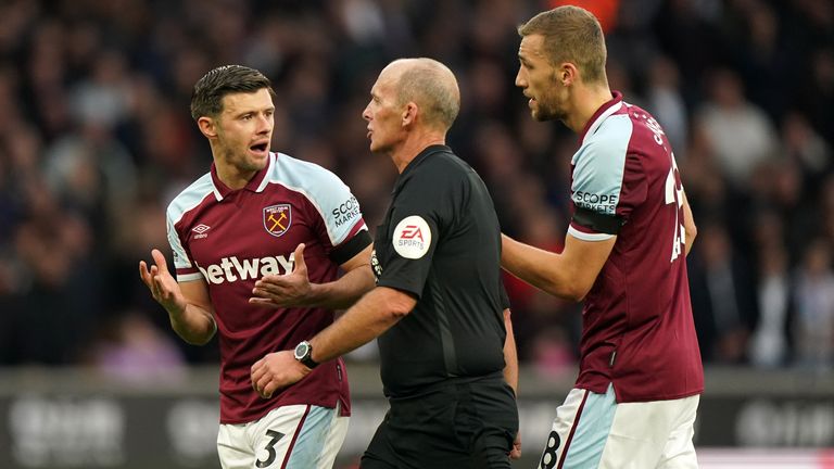 Aaron Cresswell remonstrates with referee Mike Dean