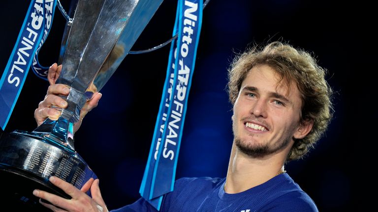 Alexander Zverev of Germany holds his trophy after winning the singles final tennis match of the ATP World Tour Finals, at the Pala Alpitour in Turin, Italy, Sunday, Nov. 21, 2021. Zverev defeated Daniil Medvedev of Russia 6-4/6-4.(AP Photo/Luca Bruno)