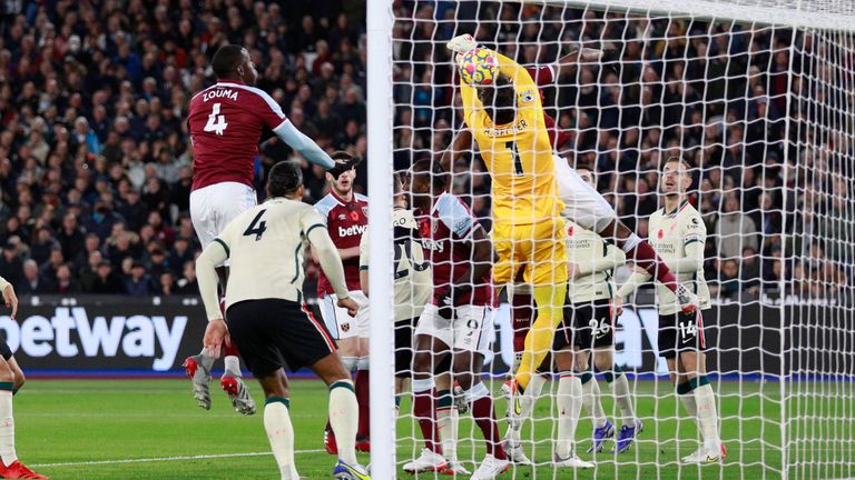 Liverpool&#39;s goalkeeper Alisson fails to save a corner kick for West Ham&#39;s Pablo Fornals to score his side&#39;s opening goal during the English Premier League soccer match between West Ham United and Liverpool at the London stadium in London, England, Sunday, Nov. 7, 2021. (AP Photo/Ian Walton)