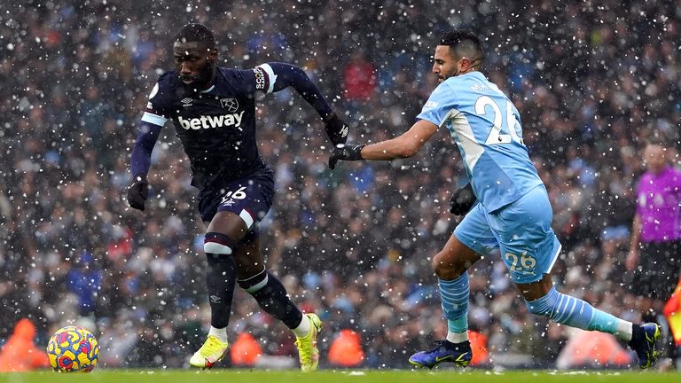 Arthur Masuaku and Riyad Mahrez battle for the ball 