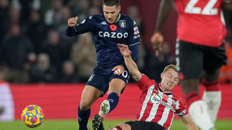 Aston Villa's Emiliano Buendia is tackled by Southampton's Oriol Romeu during the English Premier League soccer match between Southampton and Aston Villa at the Saint Mary's Stadium in Southampton, England, Friday, Nov. 5, 2021. (AP Photo/Frank Augstein)