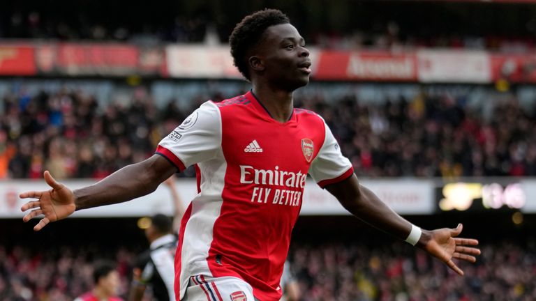 Arsenal&#39;s Bukayo Saka celebrates after scoring his side&#39;s opening goal (AP)