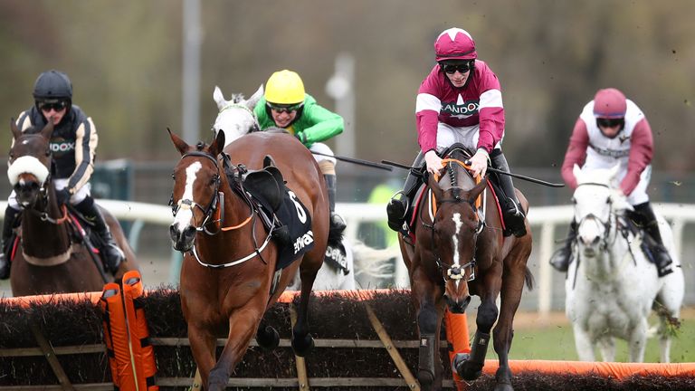 Buzz (yellow cap) chases home Abacadabras in the Aintree Hurdle in April