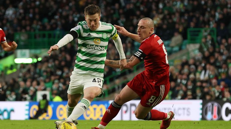 GLASGOW, SCOTLAND - NOVEMBER 28: Celtic's Callum McGregor under pressure from Aberdeen's Scott Brown (right) during a Cinch premiership match between Celtic and Aberdeen at Celtic Park, on November 28, 2021, in Glasgow, Scotland.  (Photo by Alan Harvey / SNS Group)