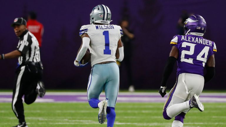 Dallas Cowboys wide receiver Ced Wilson runs from Minnesota Vikings cornerback Mackensie Alexander during a 73-yard touchdown reception