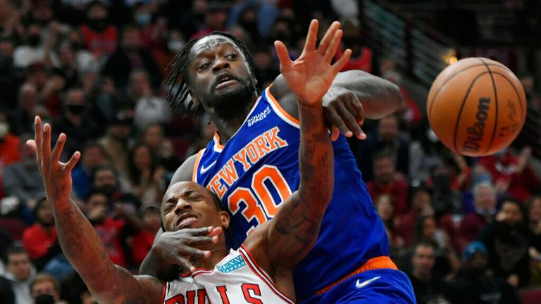Chicago Bulls' DeMar DeRozan (11) battles New York Knicks' Julius Randle (30) for a rebound during the second half of a NBA basketball game Sunday, Nov. 21, 2021 in Chicago. Chicago won 109-103. (AP Photo/Paul Beaty)