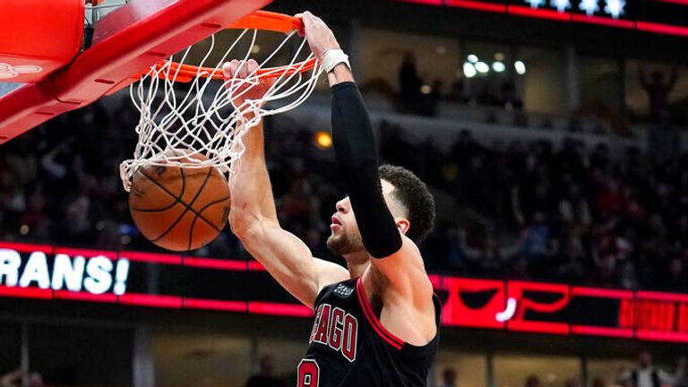 Chicago Bulls guard Zach LaVine dunks against the Dallas Mavericks during the second half of an NBA basketball game in Chicago, Wednesday, Nov. 10, 2021. The Bulls won 117-107. (AP Photo/Nam Y. Huh)