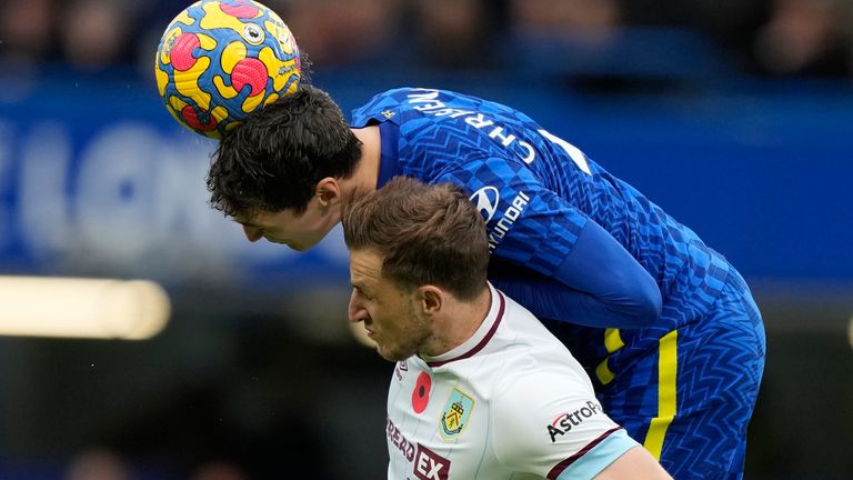 Chris Wood jumps for a header with Andreas Chistensen