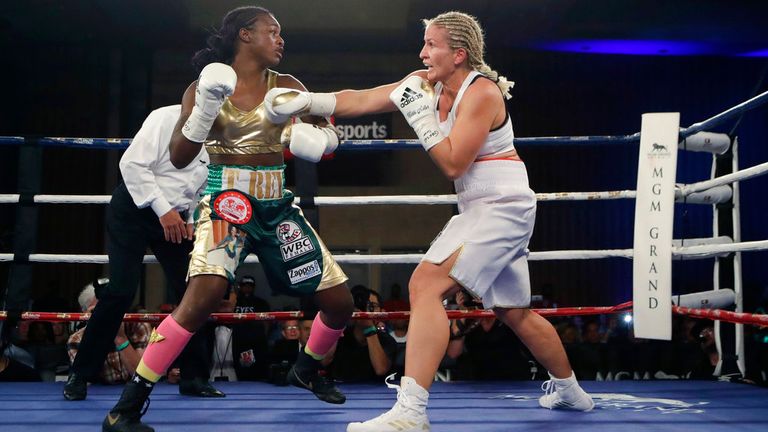 Claressa Shields, left, and Nikki Adler of Germany fight during the first round of the women&#39;s WBC super middleweight boxing bout, Friday, Aug. 4, 2017, in Detroit. (AP Photo/Carlos Osorio)