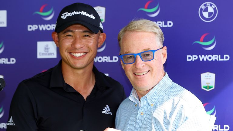 DUBAI, UNITED ARAB EMIRATES - NOVEMBER 17: Collin Morikawa of the United States smiles as he is presented with Honorary Life Membership of the DP World Tour by Tour CEO Keith Pelley during practice for The DP World Tour Championship at Jumeirah Golf Estates on November 17, 2021 in Dubai, United Arab Emirates. (Photo by Andrew Redington/Getty Images)