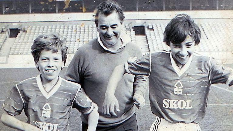Craig Bromfield (left) and brother Aaron on the pitch with Brian Clough at Nottingham Forest's City Ground the first morning of their first holiday in Nottingham [Credit: SWNS]