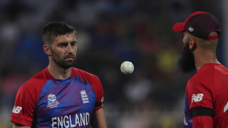 England's Mark Wood (l) with team-mate Moeen Ali at the T20 World Cup (Associated Press)