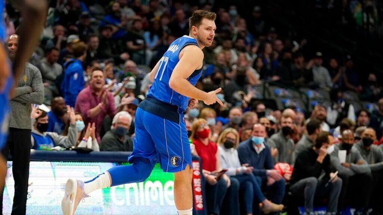 Dallas Mavericks guard Luka Doncic celebrates sinking a three-point basket in the first half of an NBA basketball game against the Cleveland Cavaliers in Dallas, Monday, Nov. 29, 2021. (AP Photo/Tony Gutierrez)