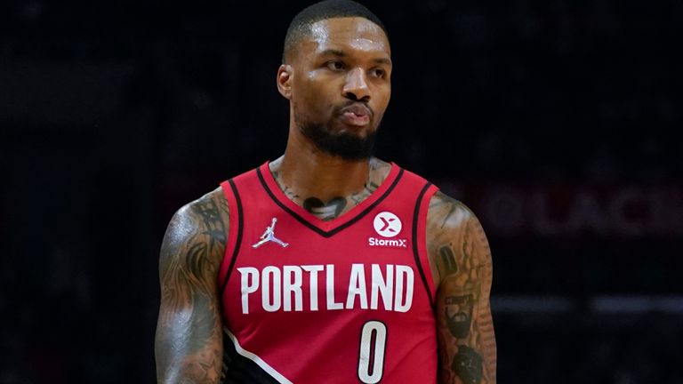 Damian Lillard walks across court against the Los Angeles Clippers