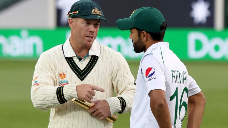 Man of the match Australia...s David Warner chats to Pakistan...s Mohammad Rizwan after their cricket test match in Adelaide, Monday, Dec. 2, 2019. (AP Photo/James Elsby)..