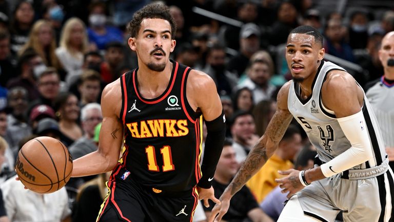Atlanta Hawks' Trae Young drives past San Antonio Spurs' Dejounte Murray