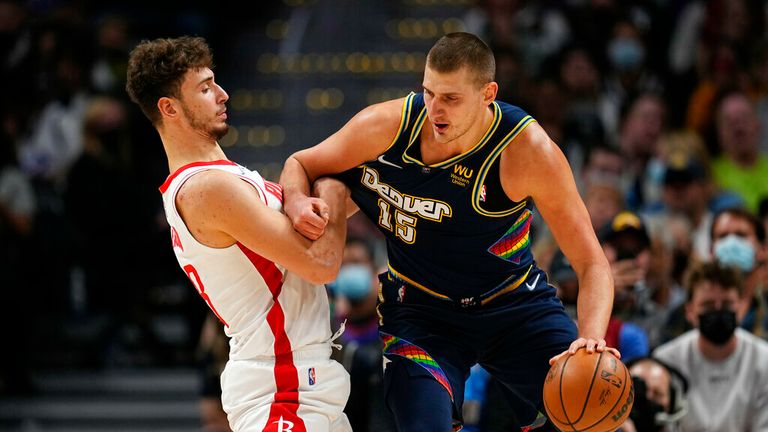 Denver Nuggets center Nikola Jokic (15) fights for position with Houston Rockets center Alperen Sengun (28) during the first half of an NBA basketball game Saturday, Nov. 6, 2021, in Denver. (AP Photo/Jack Dempsey)