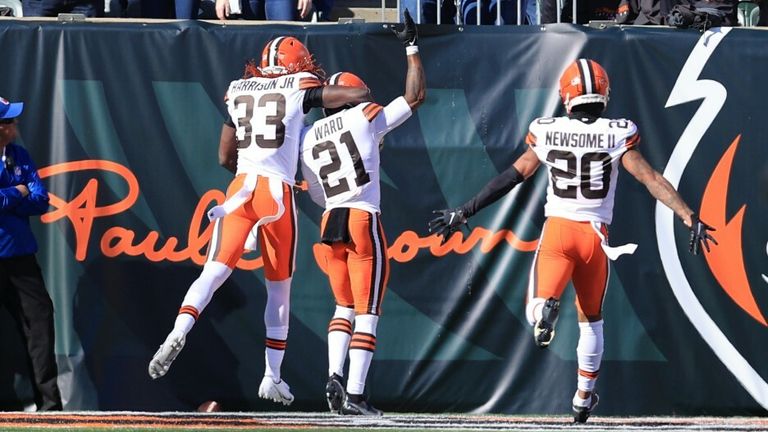 Cleveland Browns&#39; Denzel Ward (21) celebrates after returning an interception for a touchdown during the first half of an NFL football game against the Cincinnati Bengals