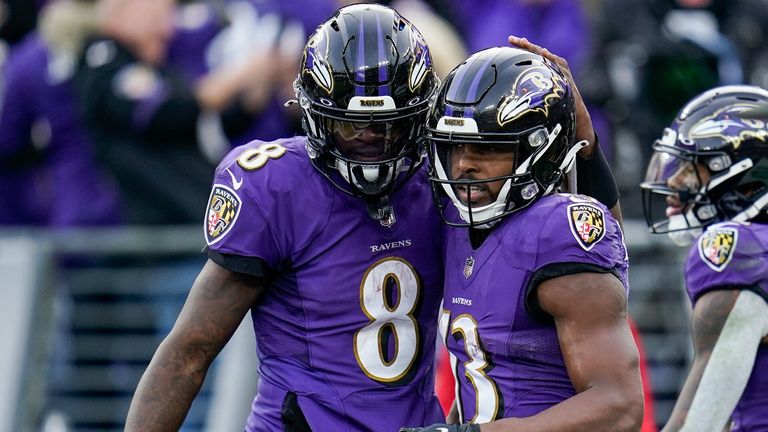 Baltimore Ravens quarterback Lamar Jackson (8) and wide receiver Devin Duvernay (13) celebrate after connecting for a touchdown during the second half of an NFL football game