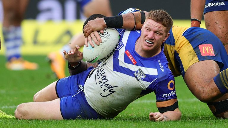 SYDNEY, AUSTRALIA - JUNE 20: Dylan Napa of the Bulldogs is tackled during the round fifteen NRL match between the Parramatta Eels and Canterbury Bankstown Bulldogs at Bankwest Stadium on June 20, 2021 in Sydney, Australia. (Photo by Pete Dovgan/Speed Media/Icon Sportswire) (Icon Sportswire via AP Images)