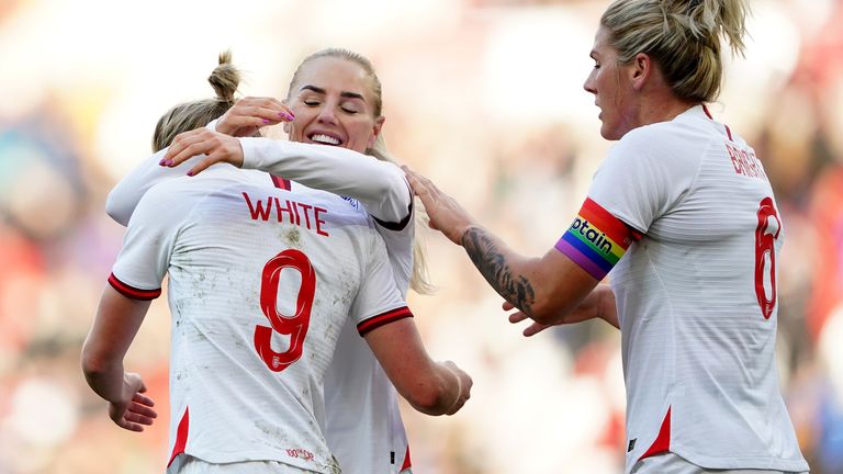 Ellen White celebrates her goal with teammates