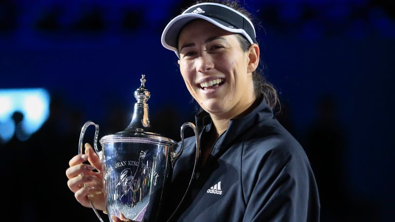 Garbine Muguruza, of Spain, holds the trophy during an awarding ceremony after defeating Anett Kontaveit, of Estonia, at the final match of the WTA Finals tennis tournament in Guadalajara, Mexico, Wednesday, Nov. 17, 2021. (AP Photo/Refugio Ruiz)