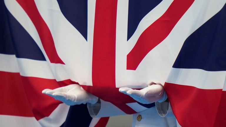 AP - Flag of Great Britain and Northern Ireland is raised during Tokyo Olympics medal ceremony