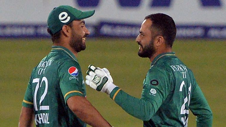 Pakistan's (R) Mohammad Nawaz greets Khushdil Shah after winning the third Twenty20 cricket match between Bangladesh and Pakistan at Sher-E-Bangla National Cricket Stadium in Dhaka on November 22, 2021. (Photo by Munir Uz zaman / AFP) (Photo by MUNIR UZ ZAMAN/AFP via Getty Images)